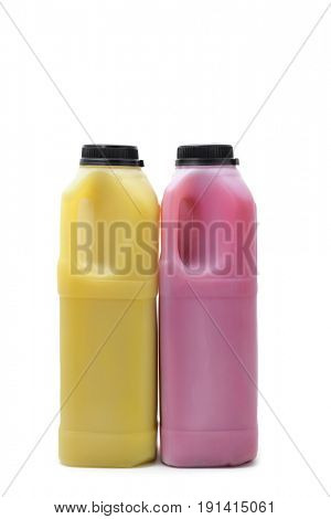 a pair of plastic bottles with an orange and a red fruit juice on a white background