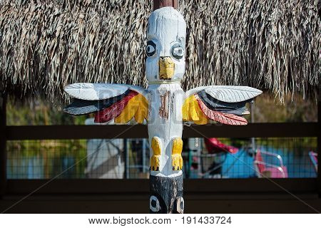 Miccosukee triibal art traditional indian totem carved from the wood in Florida USA