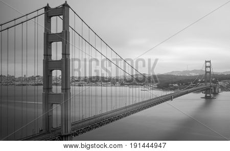 Golden Gate Bridge with no cars no people and no boats around or on it in black and white