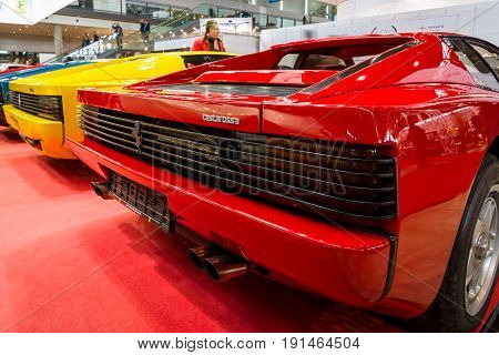 STUTTGART GERMANY - MARCH 02 2017: Rear view of various modifications of sports cars Ferrari Testarossa and F512. Europe's greatest classic car exhibition 