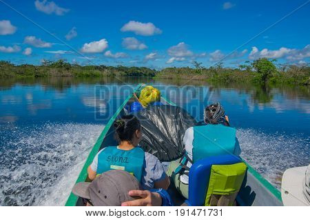 CUYABENO, ECUADOR - NOVEMBER 16, 2016: Unidentified people travelling by boat into the depth of Amazon Jungle in Cuyabeno National Park, Ecuador.