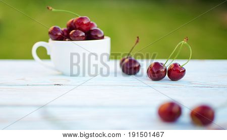 Red Ripe Cherry On A Background