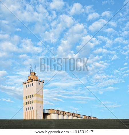 Plant for the production of baked goods with blue sky background. Factory background