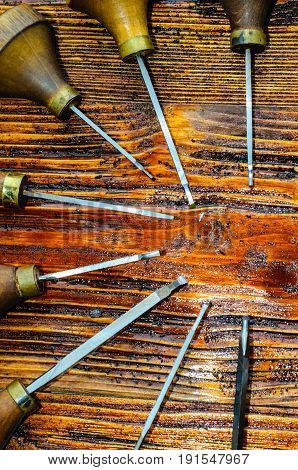 Different Gravers For Jewelry On Wooden Background