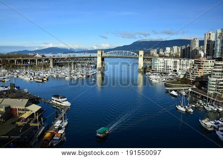 Vancouver BC, Canada, February 20th 2017.The skyline of Vancouver with False Creek and Granville island Come explore Vancouver and take home life long memories.