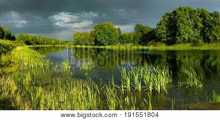 Russia Nizhny Novgorod region Volodarsky district. Big Dubkovsky lake in June at sunset of the day
