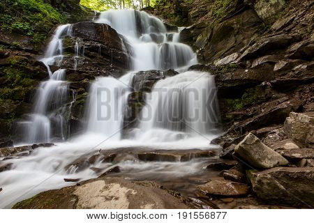 Spring water rapid waterfall in the mountains
