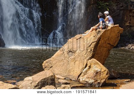 A young couple is admiring the majestic MacKenzie Falls in the Grampians Ranges - Halls Gap Victoria Australia, 10 October 2010