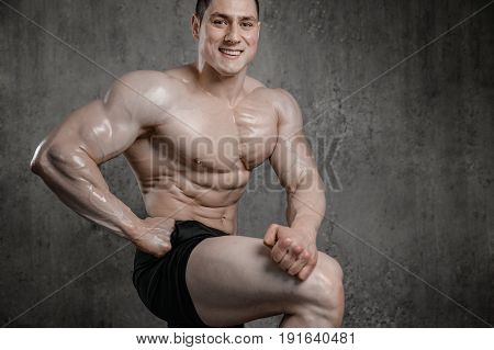 Brutal Strong Athletic Men Pumping Up Muscles