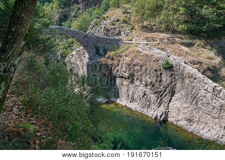 The Pont du Diable or Devil Bridge is a Roman bridge that spans the river Ardeche at about 10 m altitude. The bridge is located near the village of Thueyts in the Ardeche department in France