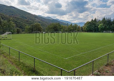 Football field located between the mountains of the Ardeche in France