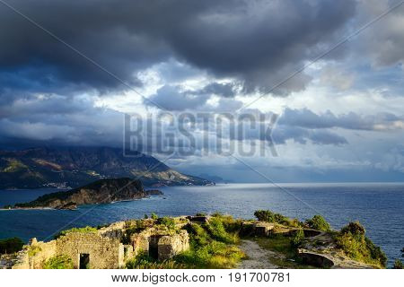 Panoramic landscape of Budva riviera from Morgen fortress ruins in Montenegro. Fantastic view of the overcast sky. Balkans, Adriatic sea, Europe. View from the top of the mountain
