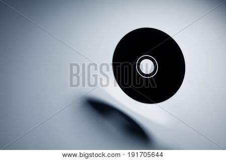 a CD  disk with dark shadow technology concept.