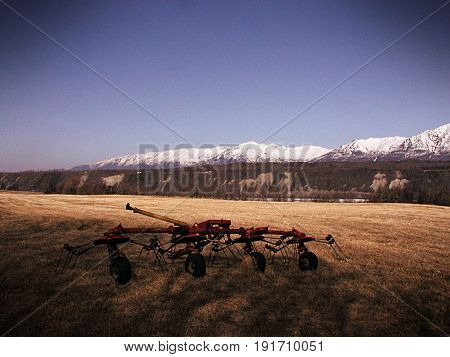 Tedder In A Hay Field With Vintage Effects