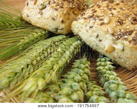Rrolls with seeds and cereals and bread grain ears