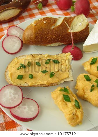 Lye roll with cheese cream and radishes