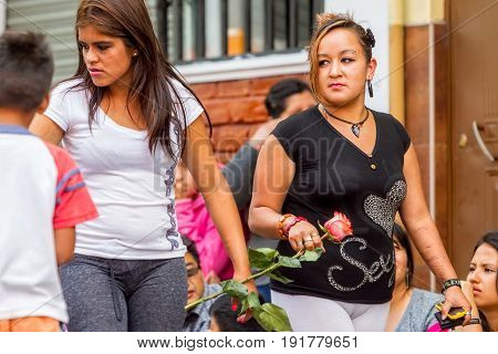 Banos De Agua Santa Ecuador - 29 November 2014: Group Of Two Hispanic Teenagers Waiting To Begin Annual Carnival On The Streets Of Banos De Agua Santa South America Christmas Holiday In Banos De Agua Santa On November 29 2014