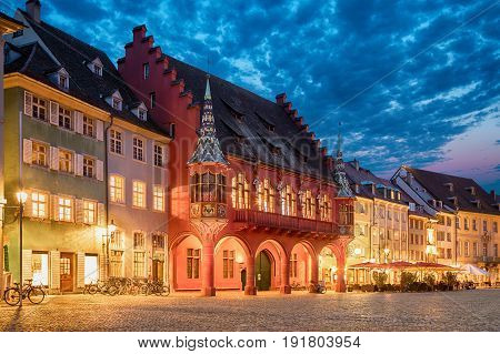 Historical building of Merchants Hall (Historisches Kaufhaus) built in 1520-21 and located on Munsterplatz squre in Freiburg Baden-Wurttemberg Germany
