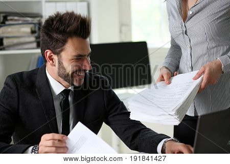 Female Employee Show Pack Of Documents To Manager