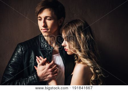 portrait of sexy couple in love. Beautiful couple touching at each other outdoor