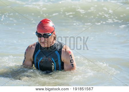 Pescara Italy - June 18 2017: Starting for the swimming test of disabled athlete Alex Zanardi at Ironman 70.3 Pescara of June 18 2017
