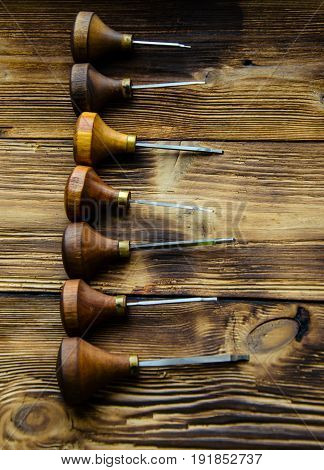 Different Gravers For Jewelry On Wooden Background
