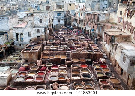 Men Working Hard In The Tannery Souk In Fez, Morocco