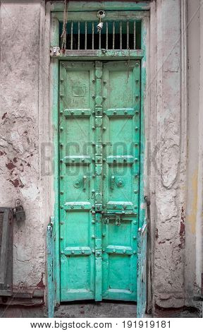an old vintage Indian door with chain locked