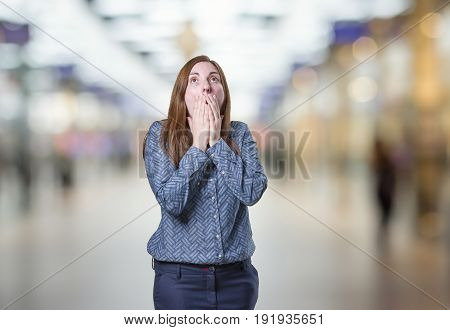 Pretty Business Woman Making Surprised Gesture Over Blur Background
