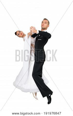 dance ballroom couple in a dance pose isolated on white background. sensual professional dancers dancing walz tango slowfox and quickstep.