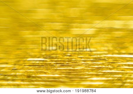 Gold Texture of Embossed Paper. Gold Paper Texture Background. Macro. Shallow depth of field. Abstract background with deep grooves in the texture of corrugated paper