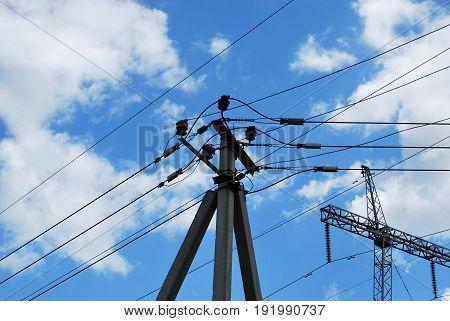 An electric pole against a blue sky background