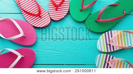Flip Flops On Blue Wooden Floor Background. Top View And Copy Space. Summer Fun Weekend