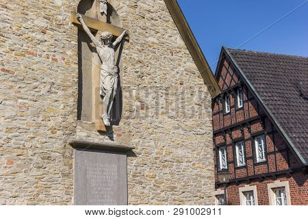 Statue Of Jesus At The Facade Of The Petrikapelle In Freckenhorst, Germany