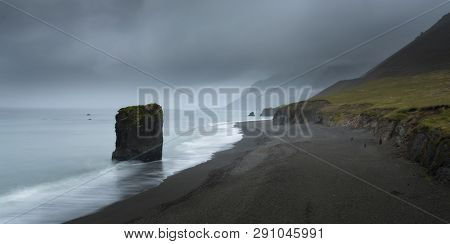 Typical Icelandic Seascape With Black Basalt Sand. Dramatic Summer Evening On The West Coast Of Icel