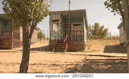 Abandoned Guest House On The Sandy Shore In Summer