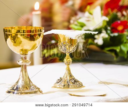 Cup With Wine And Ciborium With Host On The Altar Of The Holy Mass