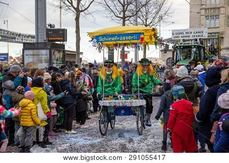 Basel, Switzerland - March 11, 2019: Participants And Spectators At The Parade Of The Yearly Carniva