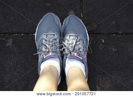 Paphos, Cyprus - October 09, 2015 Nike Downshifter Running Shoes On Woman Feet.