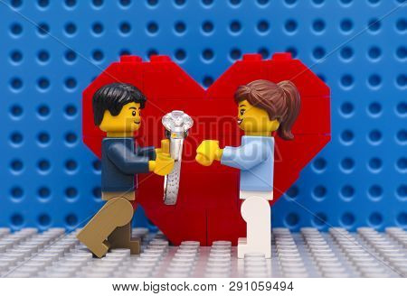Tambov, Russian Federation - September 03, 2015 Lego Man With Ring Makes Marriage Proposal To His Gi
