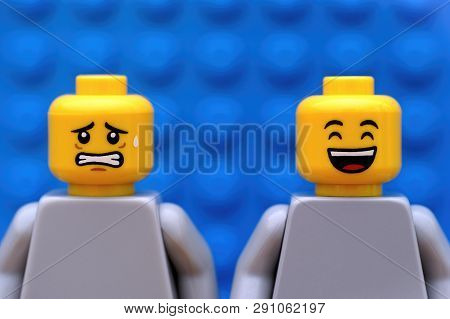 Tambov, Russian Federation - July 24, 2016 Two Lego Minifigures - One Scared And One Happy. Blue Bac