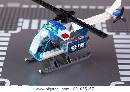 Tambov, Russian Federation - August 27, 2014 Lego Police Helicopter With Pilot On Lego Baseplate Bac