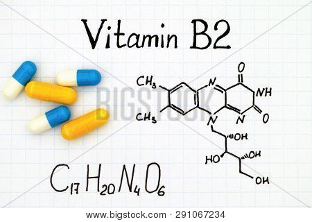 Chemical Formula Of Vitamin B2 And Pills.