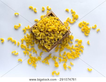 Italian Food Concept And Menu Design. Uncooked Pasta On White Background. Flat Lay. Top View.