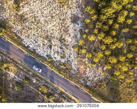 Car Driving Road Through Barren Landscape In Cevennes Near Ganges, Occitania, France