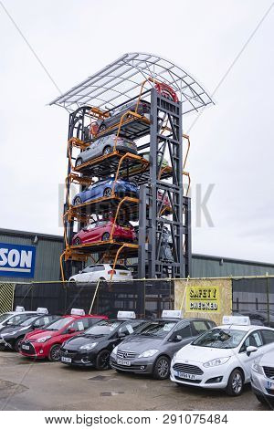 Aylesbury, Uk - December 06, 2018. A Rotary Parking System Is Used On An Industrial Estate. The Syst