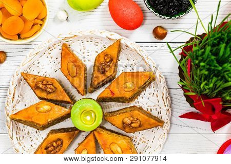 Novruz Ramadan In Azerbaijan. Colored Eggs, Wheat Springs For Easter And Traditional Sweets. Selecti