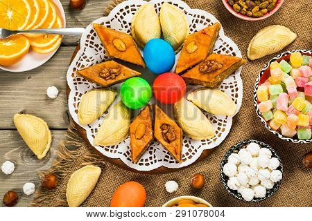 Novruz Ramadan In Azerbaijan. Colored Eggs, Wheat Springs For Easter And Traditional Sweets. Selecti