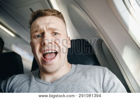 Concept Aerophobia. Afraid Of Fear Flying On An Airplane And At Height.