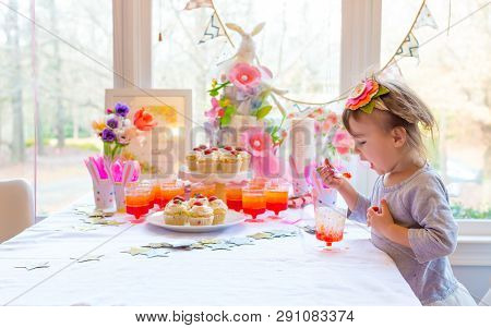 Little Toddler Girl Eating Dessert After Easter Dinner